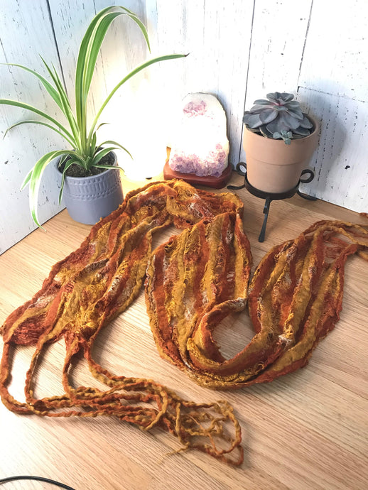 Soft merino wool scarf in a patina and rust color with tussah silk