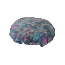 Load image into Gallery viewer, bottom view of &quot; Unicorn&#39;s Breath Meditation Cushion&quot; a round artisan made floor meditation cushion. hand made with merino wool felted into silk fabric with a leopard print various shades of blues teals some purples pinks and white shimmer. white background
